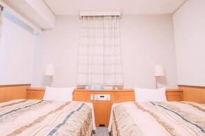 Quarto duplo standard, para não fumantes | Cortinas blackout, ferros/tábuas de passar roupa, Wi-Fi de cortesia