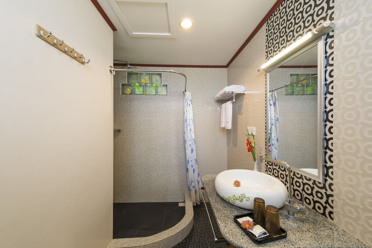 superior room | bathroom | shower, free toiletries, hair dryer, slippers