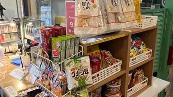 A retail display with packaged goods and a cash register.