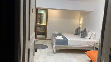 Deluxe Room, 1 King Bed, Patio, Courtyard Area | Free WiFi, bed sheets