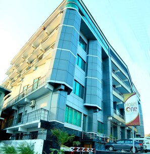 A modern hotel building with multiple floors, balconies, and a prominent 'Hotel One' sign. - Hotel One Abbottabad (Abbottabad)