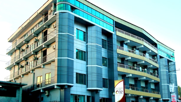 A multi-story hotel with balconies, large windows, and a prominent 'Hotel One' sign. - Hotel One Abbottabad (Abbottabad)