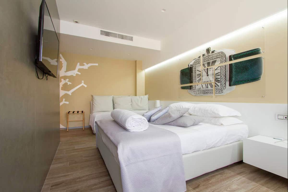 Triple Room (Cartier) | Frette Italian sheets, premium bedding, down duvets, memory-foam beds