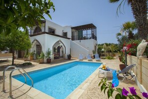 Seasonal outdoor pool, pool loungers