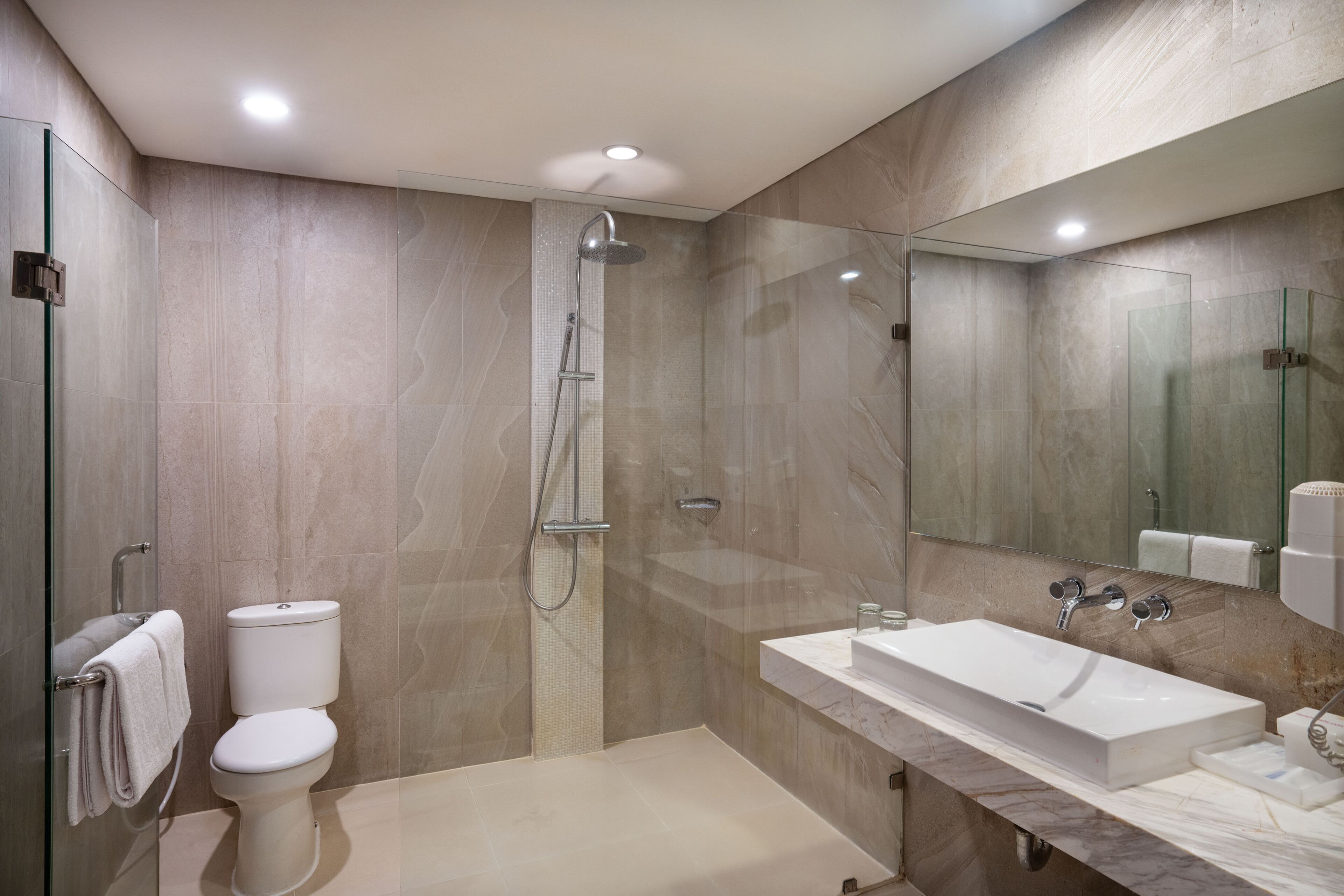 junior suite | bathroom | shower, rainfall showerhead, free toiletries, slippers