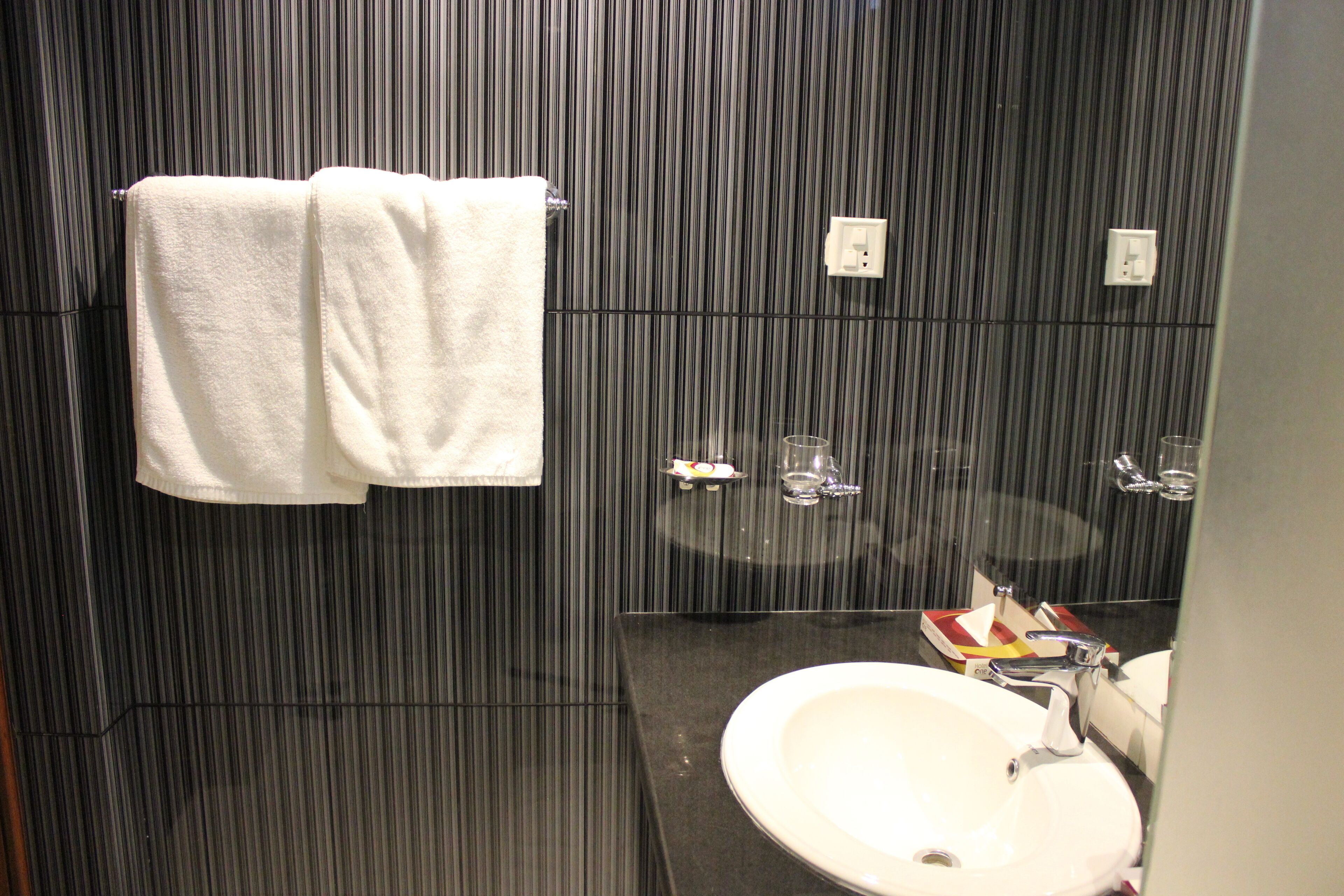 executive room | bathroom | shower, free toiletries, hair dryer, slippers