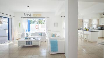 Villa, 4 Bedrooms | Living area | Flat-screen TV, fireplace, DVD player