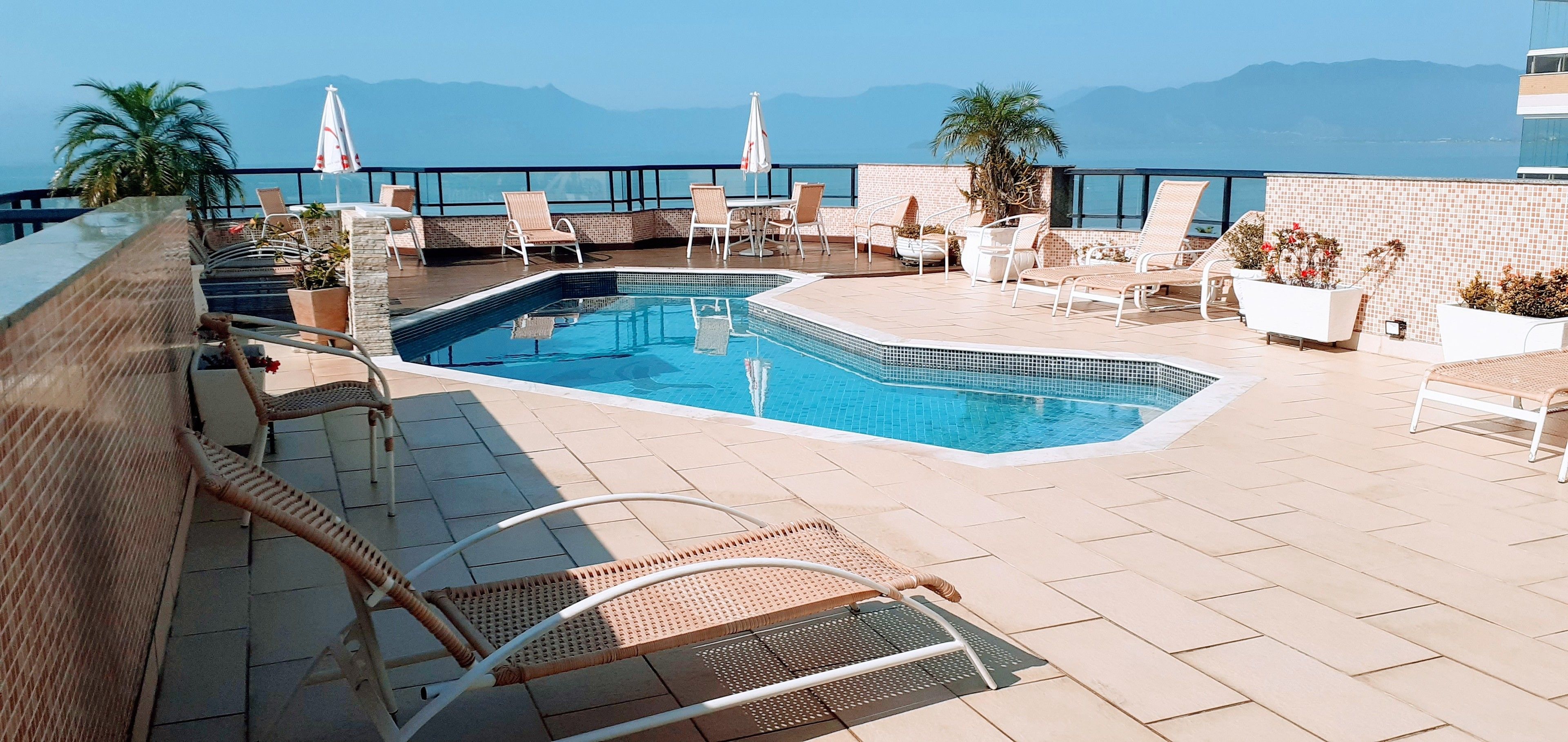 outdoor pool, open 8:30 am to 9:30 pm, pool umbrellas, pool loungers