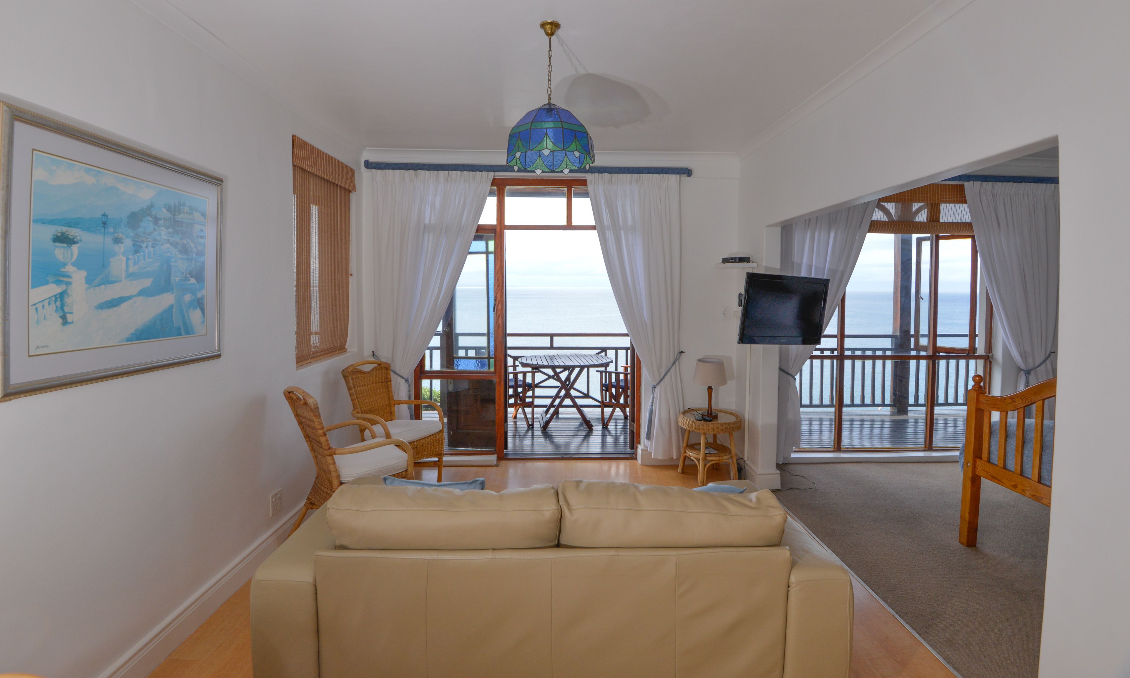 apartment, 1 bedroom, sea view (twin penguin) | living area | flat-screen tv