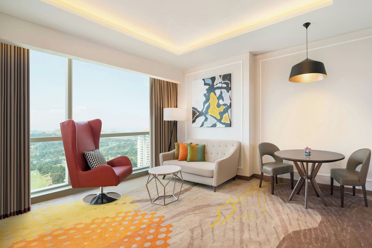 Suite,1 King Bed, Club Lounge Access | Living room | 55-inch LED TV with cable channels, TV