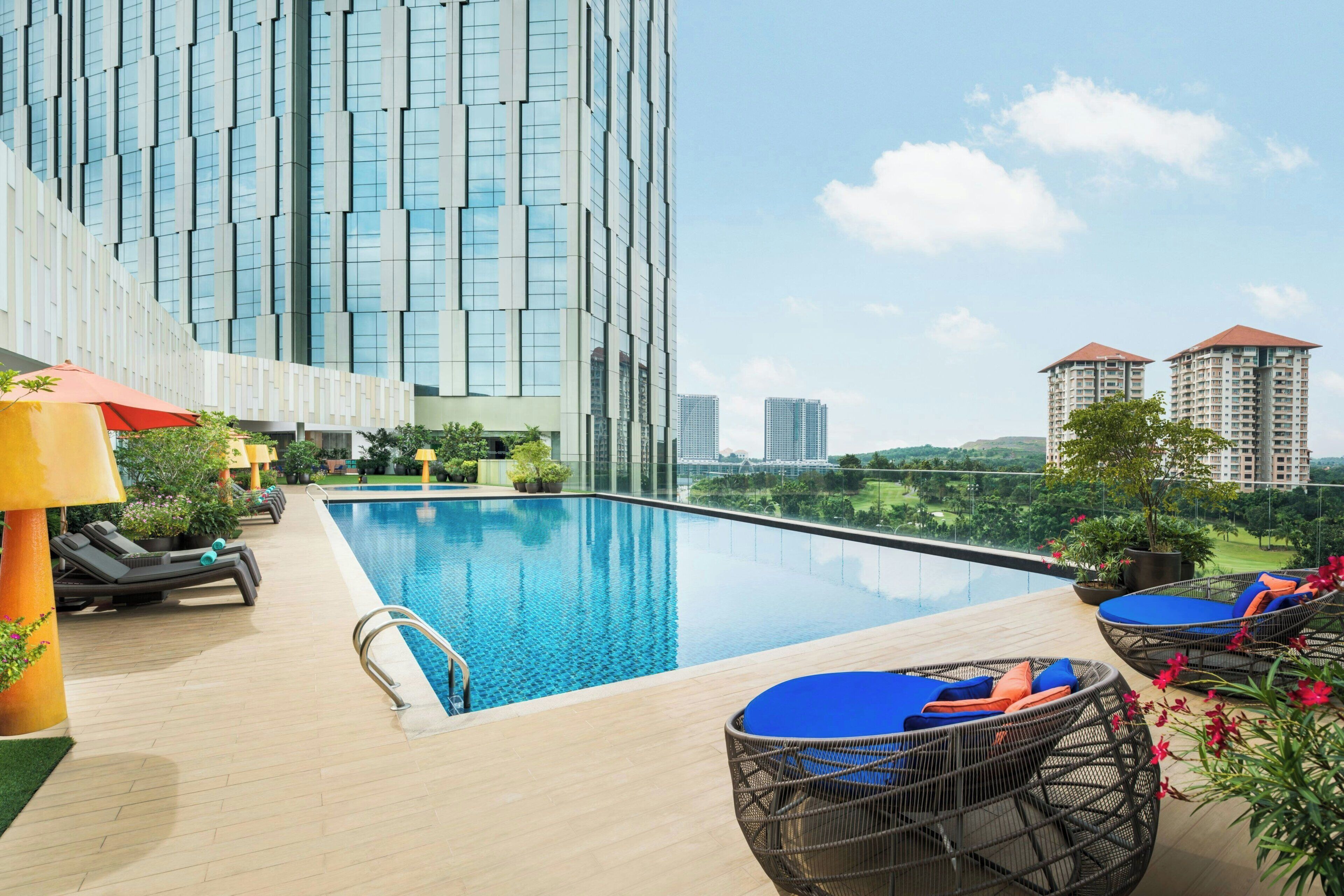 Outdoor pool, open 7:00 AM to 8:00 PM, pool loungers