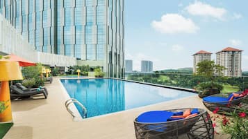 Outdoor pool, open 7:00 AM to 8:00 PM, pool loungers