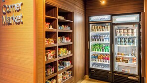 A corner market with shelves stocked with snacks, beverages, and packaged goods. - Fairfield Inn & Suites by Marriott Butte (Butte)