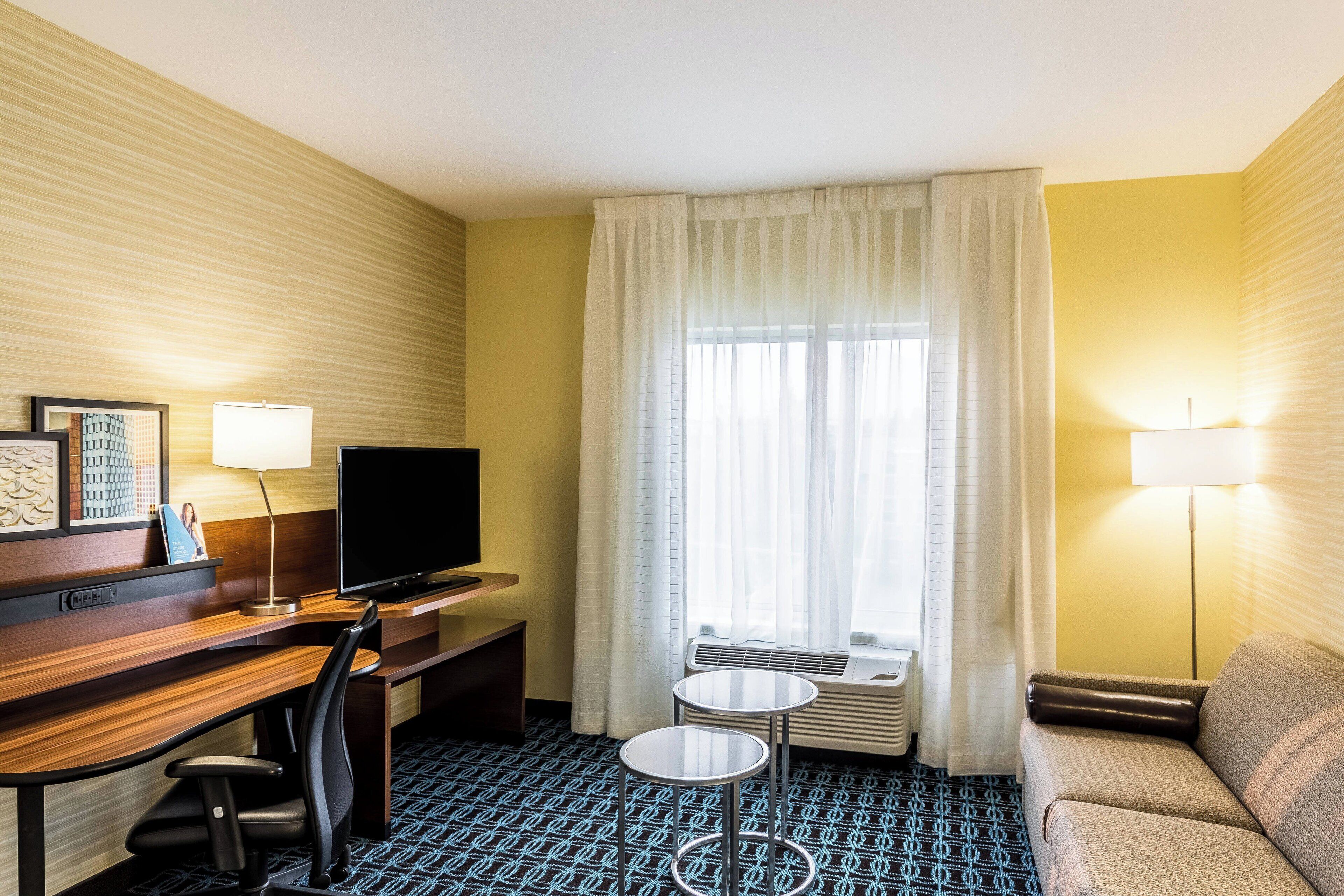 suite, multiple beds | living area | 32-inch smart tv with premium tv channels, tv, netflix