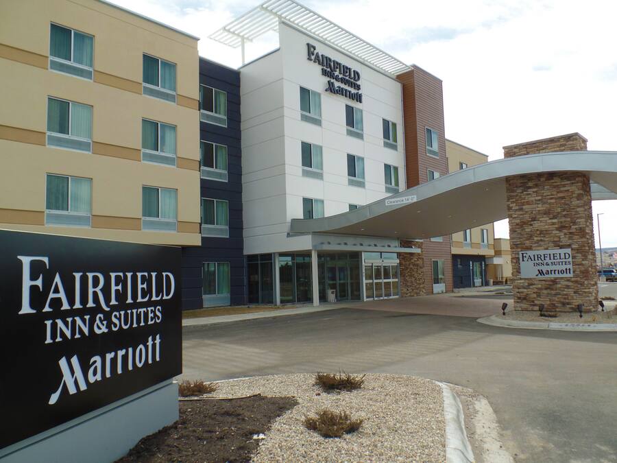 A Fairfield Inn & Suites Marriott hotel with a modern facade, multiple entry points, and a clear signage.