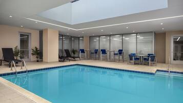 Indoor pool, open 10:00 AM to 10:00 PM, pool loungers