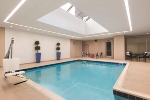 Indoor pool, open 10:00 AM to 10:00 PM, pool loungers