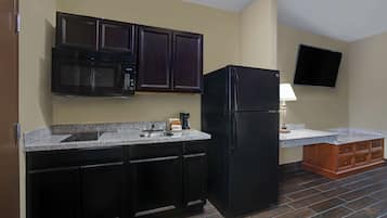 Tabla de planchar con plancha, wifi gratis y ropa de cama