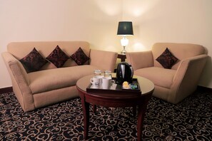 Deluxe King Room | Living area | LED TV, DVD player - The Residency Hotel (Lahore)