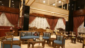 A luxurious lobby with ornate furniture, a grand staircase, and a chandelier. - Roshan Al Azhar Hotel (Jeddah)