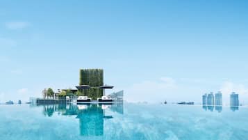 Outdoor pool, open 9 AM to 8 PM, free cabanas, pool umbrellas