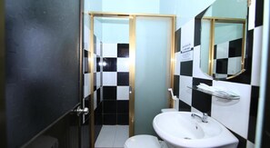 Shower, designer toiletries, hair dryer, slippers