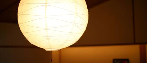 A hanging paper lantern with a grid pattern.