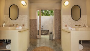 A bathroom with two sinks, a large bathtub, and a mirror on each side. - Villa Alea by Villa Finder (Kerobokan)