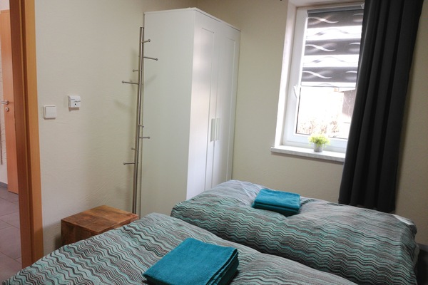 Condo básico, 2 quartos, sacada | 2 quartos, frigobar, cortinas blackout, ferros/tábuas de passar roupa