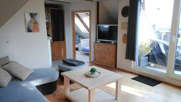 Basic Condo, 2 Bedrooms, Balcony | Living area | 120-cm flat-screen TV with satellite channels, TV