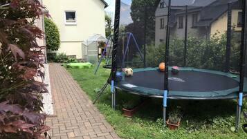 Enjoy a fun outdoor space with a trampoline and garden.
