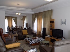 Deluxe Duplex, 3 Bedrooms, Ensuite, Poolside | Living area | Flat-screen TV, pay films