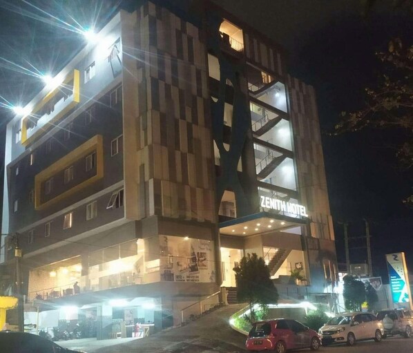A multi-story hotel with a prominent entrance and signage. - Zenith Hotel Kendari (Kendari)