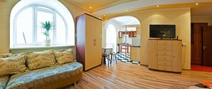 Romantic Studio Suite, Balcony (Zheltoksan Street 78) | Living area | 32-inch flat-screen TV with cable channels, LCD TV - Lessor Apartments (Almaty)