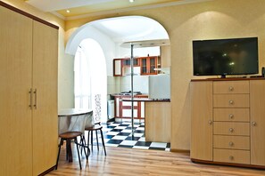 Romantic Studio Suite, Balcony (Zheltoksan Street 78) | Living area | 32-inch flat-screen TV with cable channels, LCD TV - Lessor Apartments (Almaty)