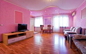 Family Apartment, 1 Bedroom, Balcony (83A Kunaev St.) | Living area | 32-inch flat-screen TV with cable channels, LCD TV - Lessor Apartments (Almaty)