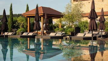 Indoor pool, seasonal outdoor pool, pool umbrellas, pool loungers