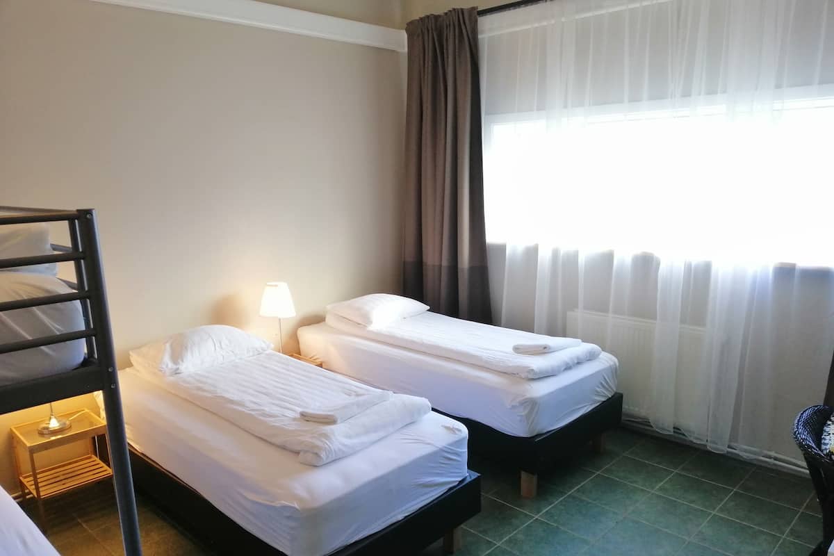 Standard Quadruple Room, Shared Bathroom | Desk, blackout drapes, soundproofing, free WiFi