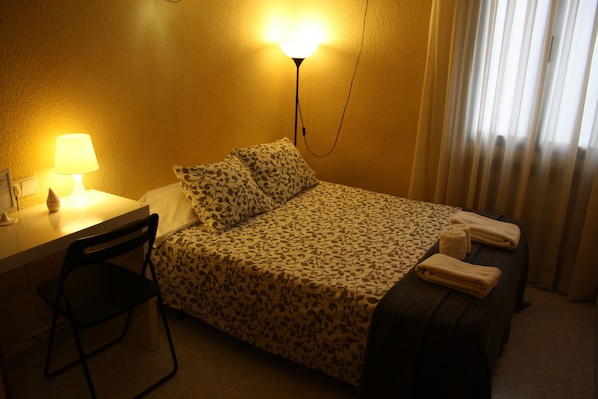 Desk, laptop workspace, blackout drapes, iron/ironing board