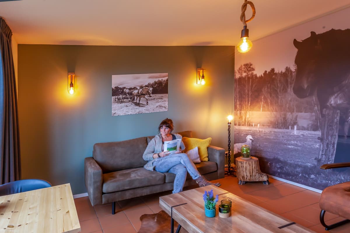 Premium Apartment | Living area | Flat-screen TV, heated floors