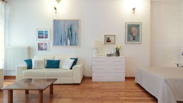 Exclusive Studio Suite | Living area | 20-inch flat-screen TV with digital channels