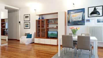 Exclusive Studio Suite | Living area | 20-inch flat-screen TV with digital channels