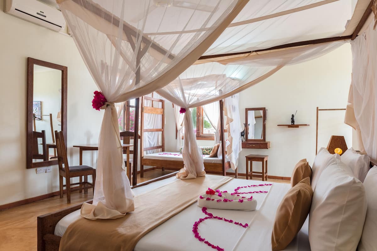 Triple Room, Patio | Minibar, rollaway beds, free WiFi, bed sheets