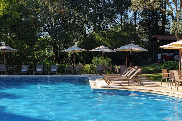 Indoor pool, outdoor pool, pool umbrellas, pool loungers