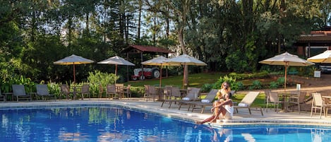 Indoor pool, outdoor pool, pool umbrellas, pool loungers