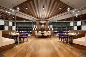 Enjoy meals in this stylish dining area with a round table and six chairs.