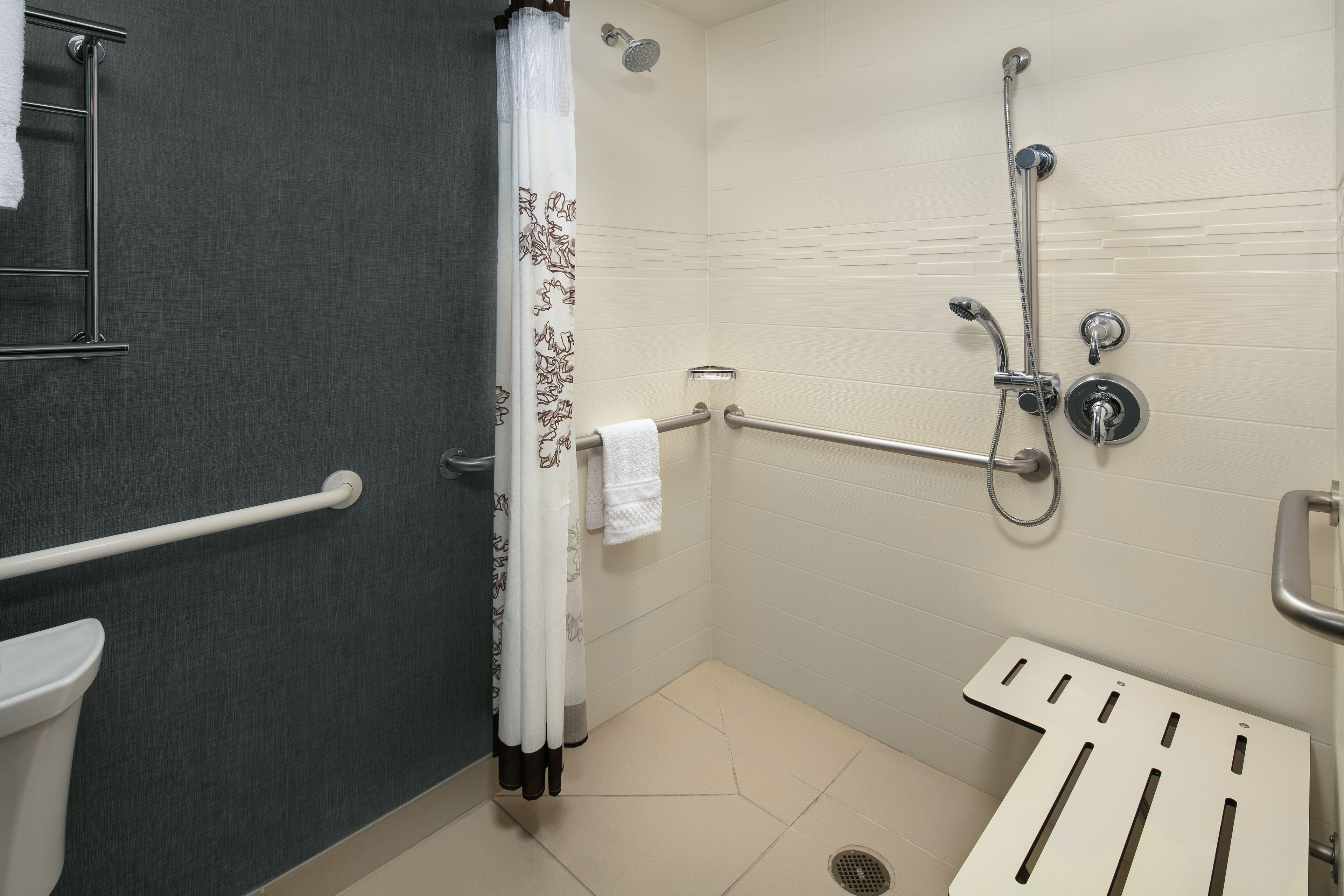 rainfall showerhead, hair dryer, towels