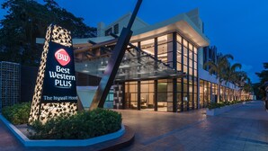 The exterior of the Best Western Plus hotel with a modern design, including a prominent sign and a well-lit entrance.