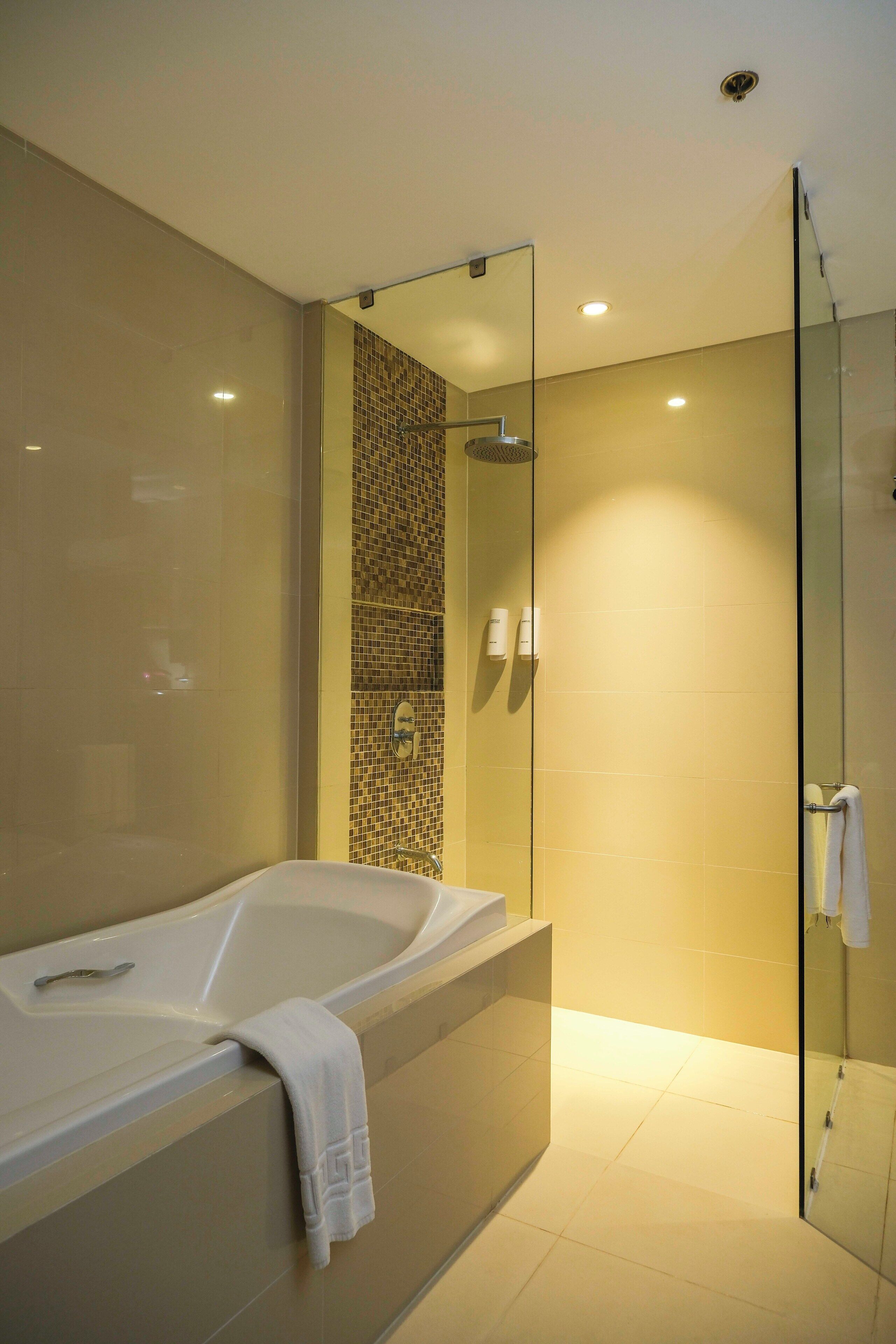 suite, 1 king bed, non smoking, refrigerator | bathroom | shower, free toiletries, hair dryer, bathrobes