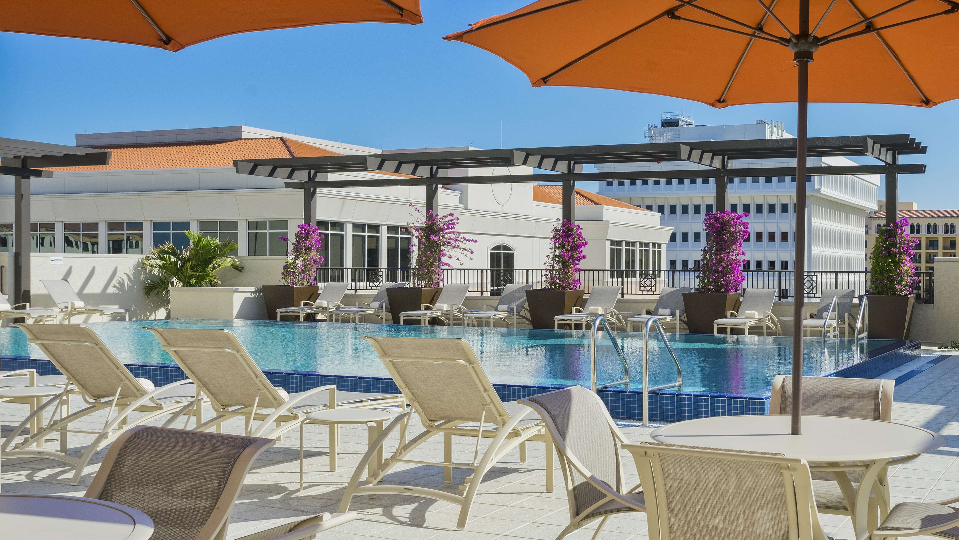 outdoor pool, open 6:00 am to 10 pm, pool loungers